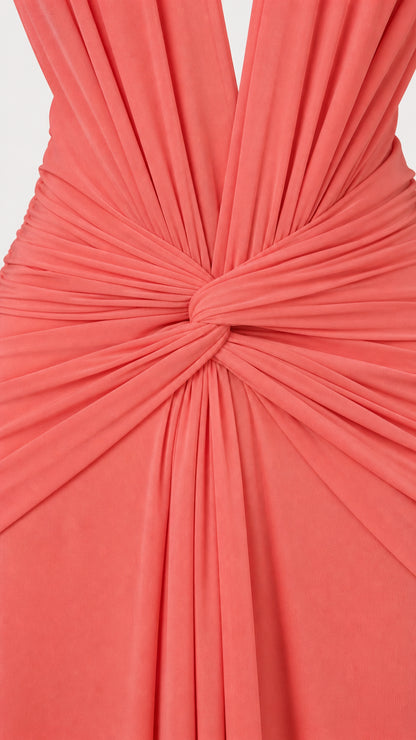 Close up of knot ruching detail on coral plunge maxi dress