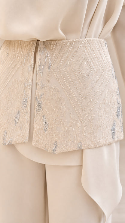 Close up of embellished waist detail on cream set