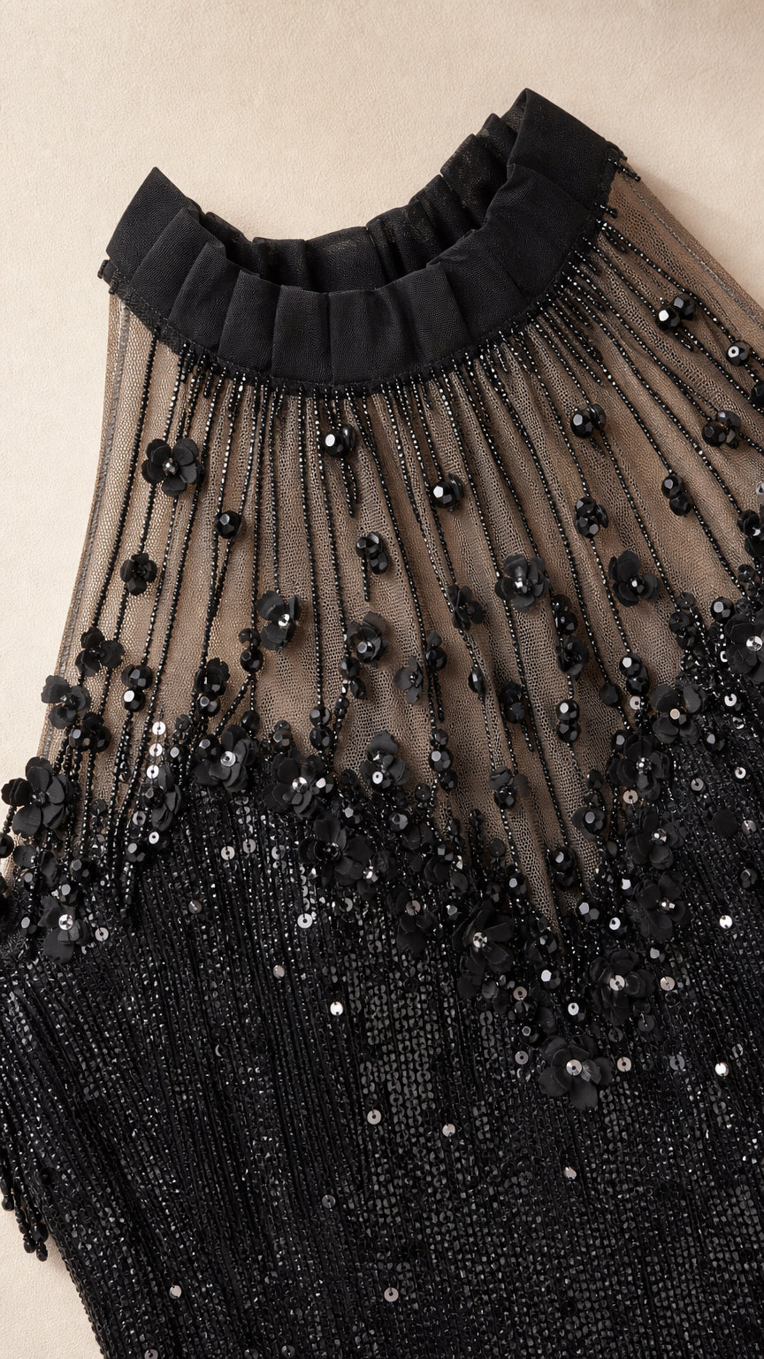 Close-up of black dress sequin and bead embroidery detail