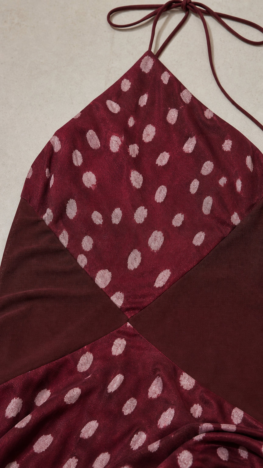 Close up of halter neck and patterned fabric detail
