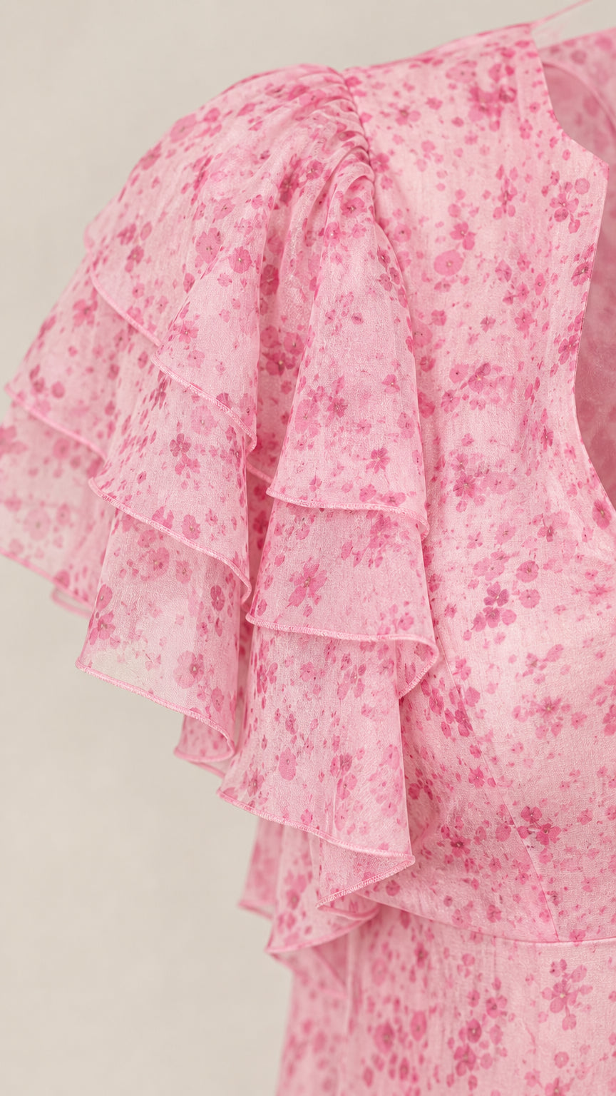 Close-up of layered ruffle sleeve on pink floral dress