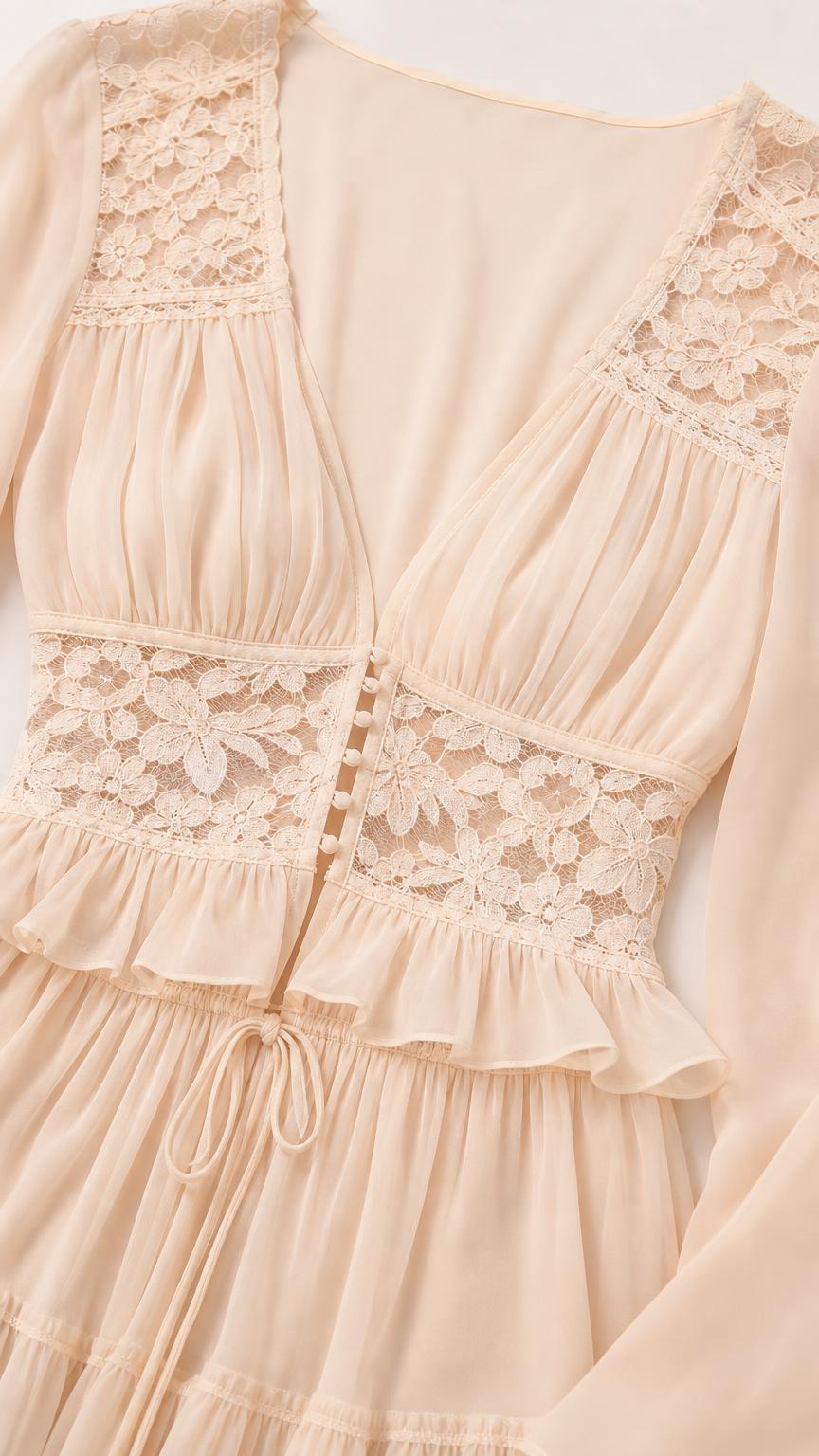 Close-up detail of lace inserts and V-neckline on Ivory dress