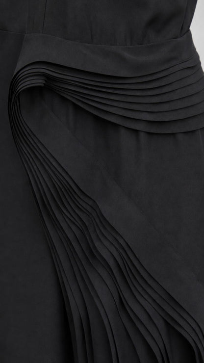 Close-up detail of accordion pleating on dress