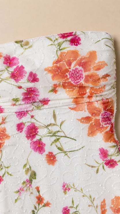 Close-up of vibrant floral fabric and texture on white background