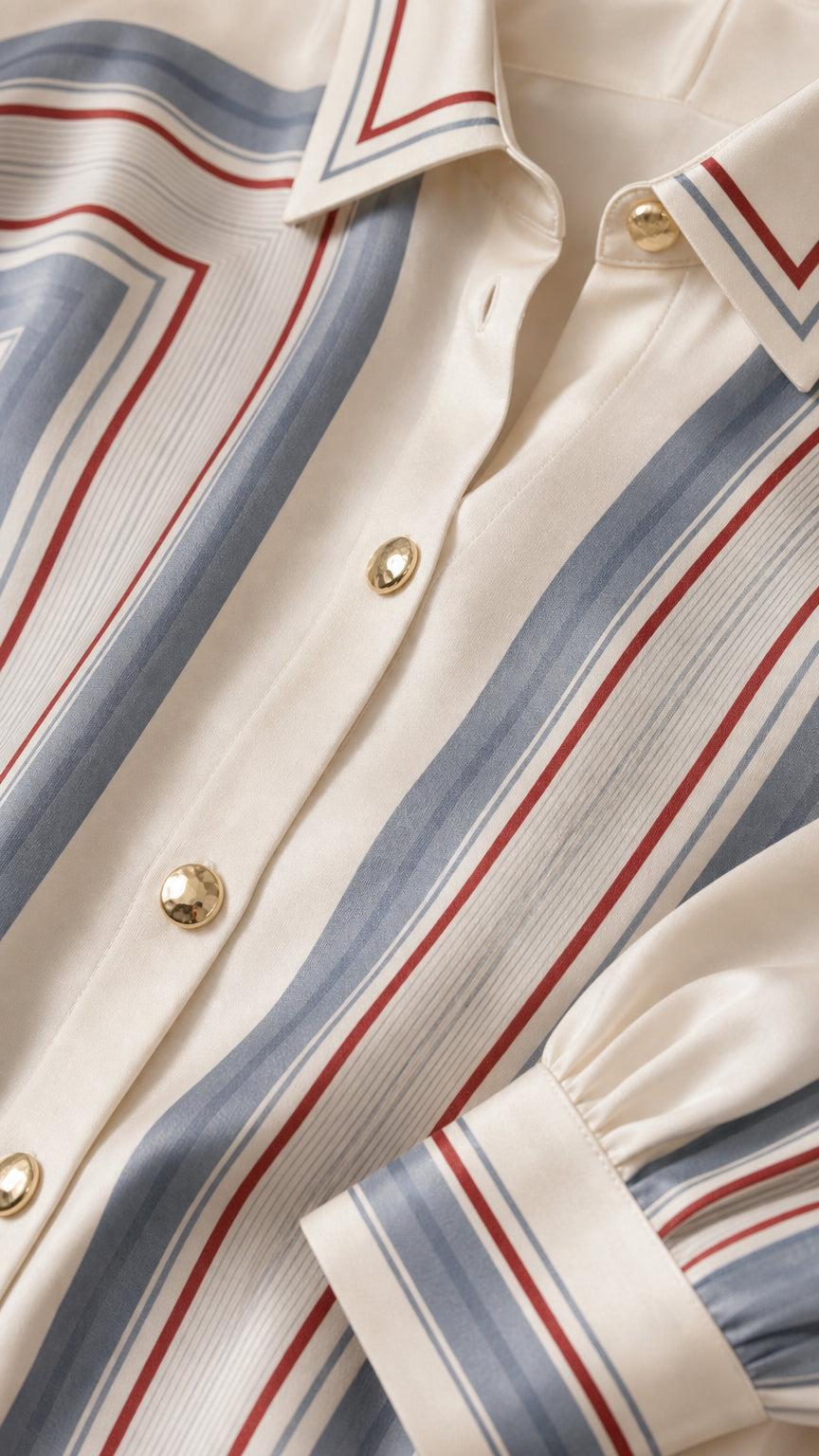 Close-up detail of buttons, collar, and fabric texture on striped shirt