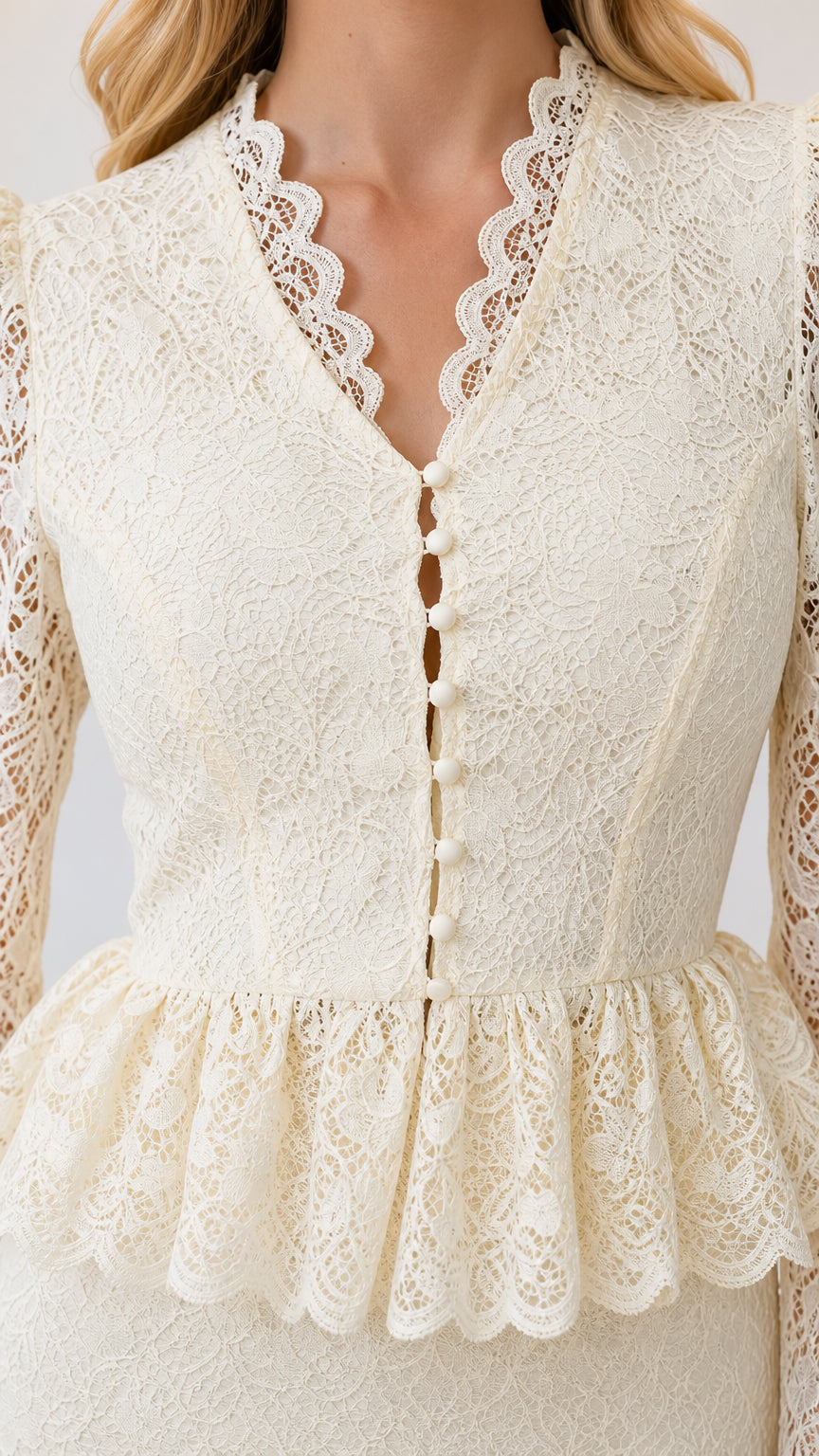 Close-up detail of scalloped V-neckline, buttons, and peplum waist in ivory lace