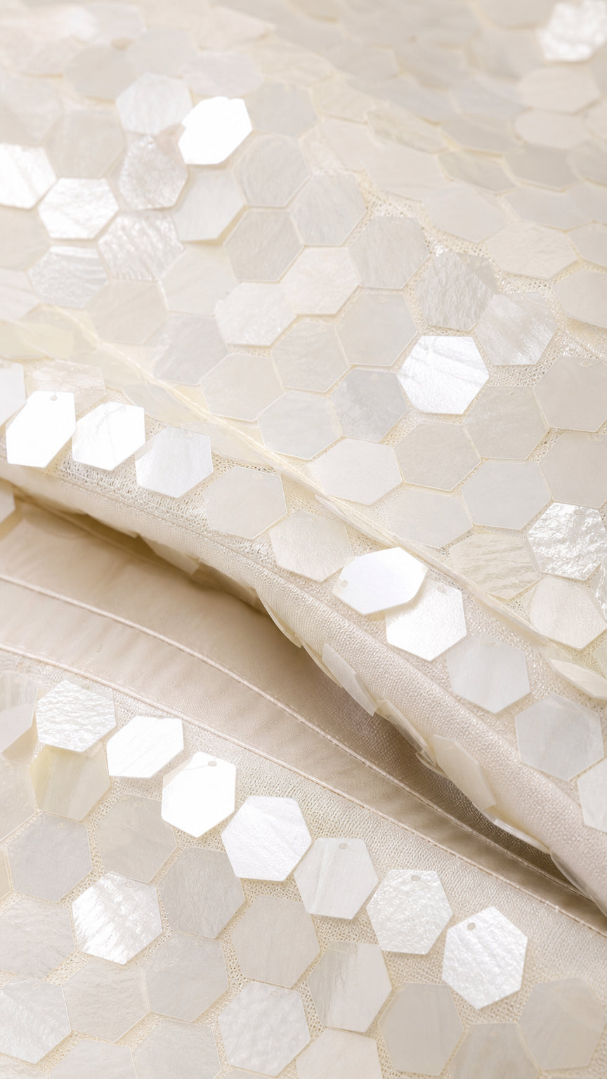 Close-up of hexagonal sequin texture and fabric detail