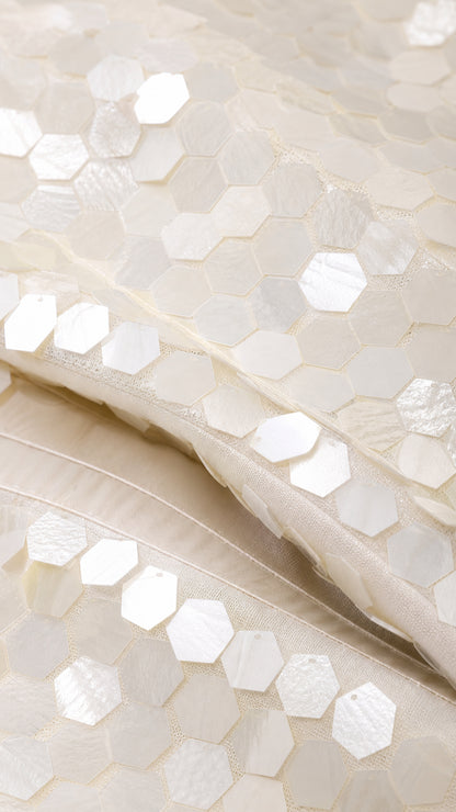 Close-up of hexagonal sequin texture and fabric detail