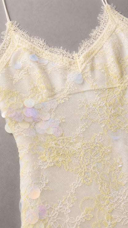 Close-up of the ivory floral lace overlay and delicate lace-trimmed neckline