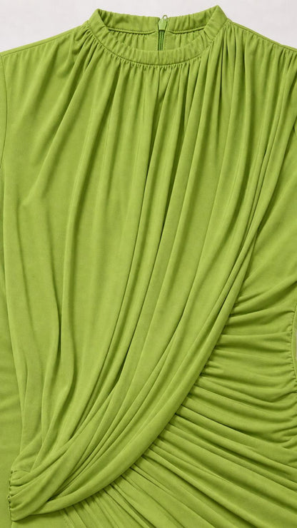 Close up of green dress fabric, neckline, and draped ruching details
