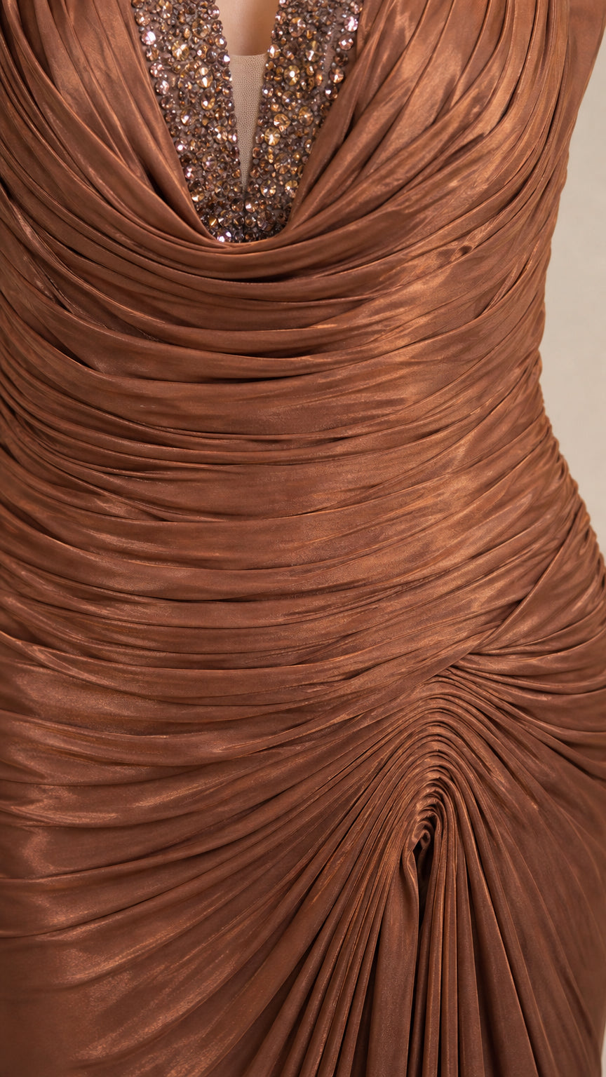 Close-up of mocha brown dress showing intricate beaded trim and ruched draping fabric