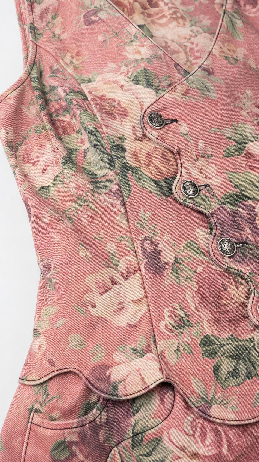 Close-up detail of buttons and floral fabric texture