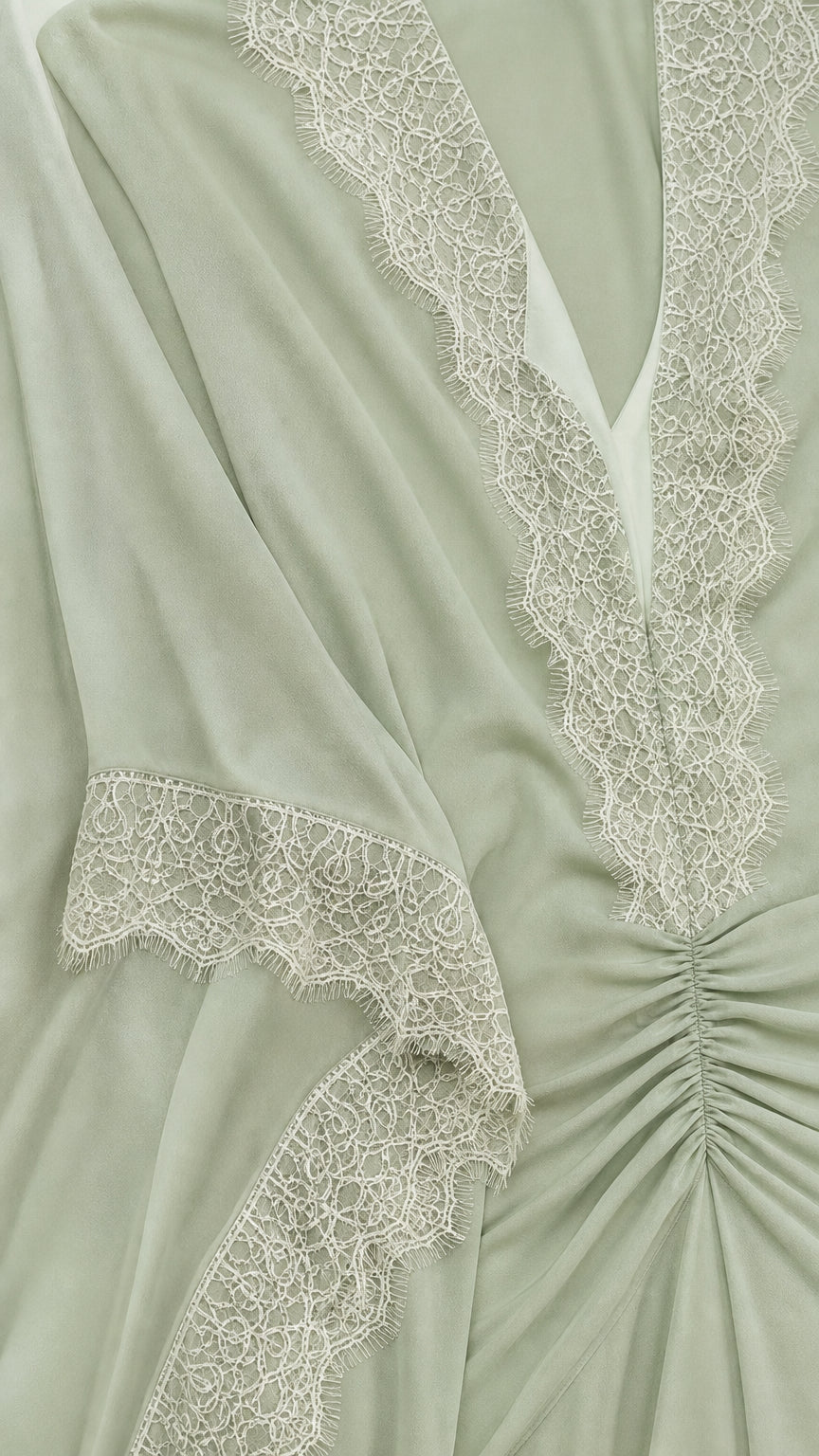Close up of delicate lace neckline and ruched waist detail on Sage Green dress