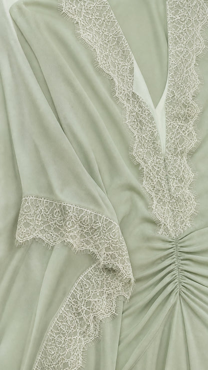 Close up of delicate lace neckline and ruched waist detail on Sage Green dress