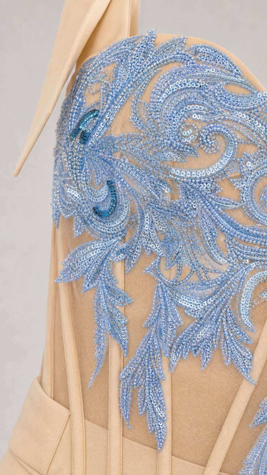 Close-up of blue embroidery and sequin bodice detail