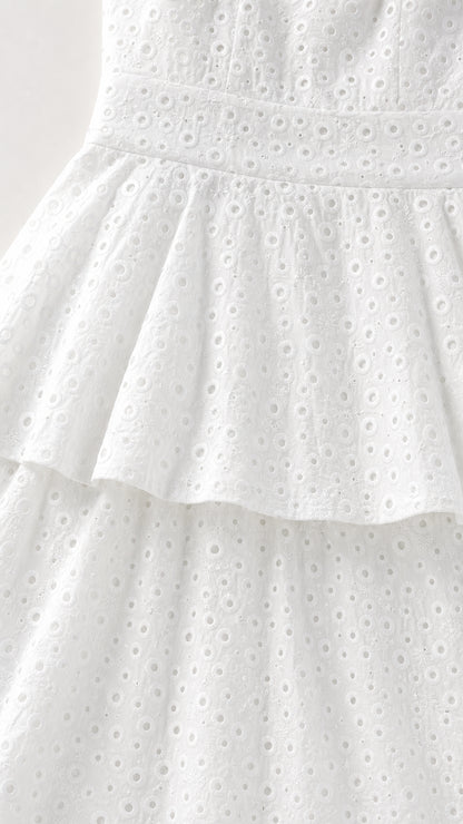 Close-up of fabric texture on white eyelet maxi dress
