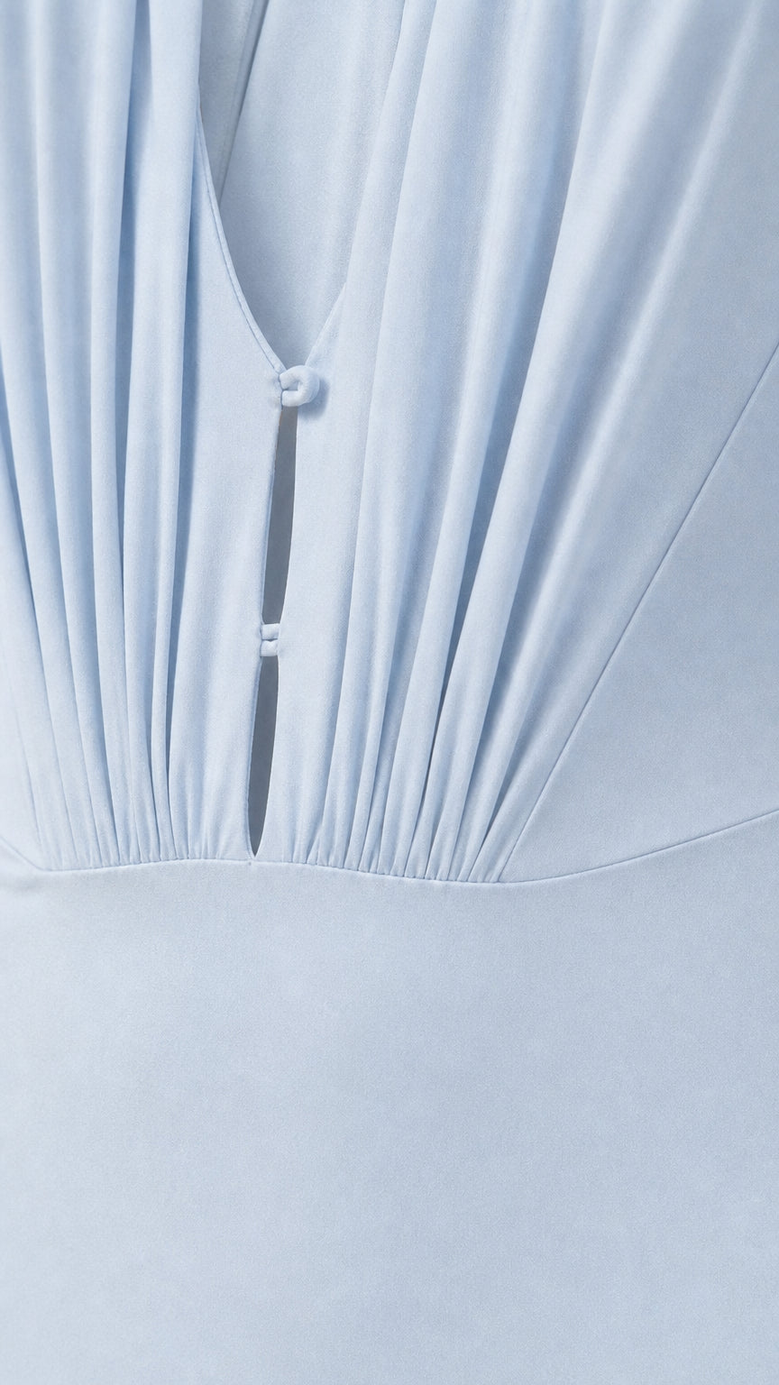 Close-up of ruched bodice and button detail on Light Blue dress