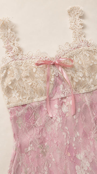 Close up of lace bodice and bow on pink dress