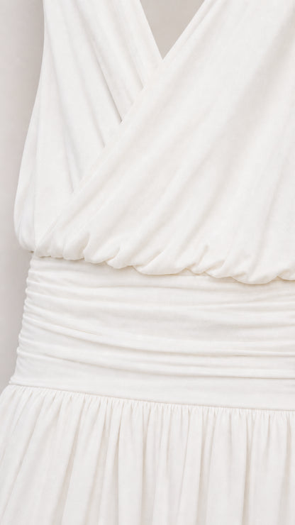 Close-up of draped surplice bodice and gathered waist