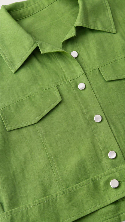 Close-up detail of the green shirt collar and button details