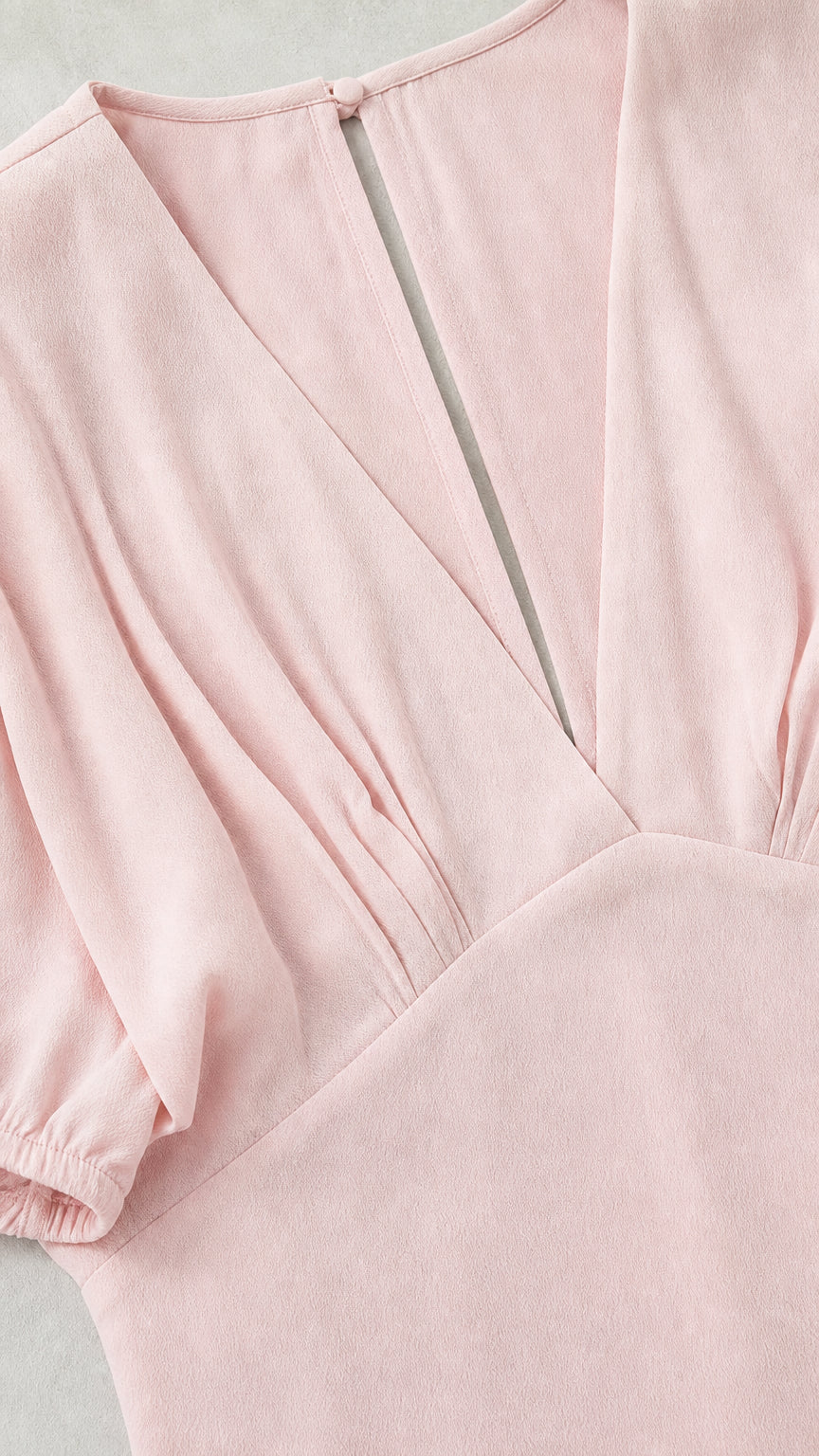 Close-up of neckline, gathering, and fabric texture