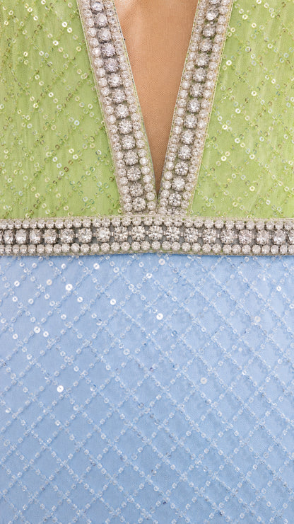 Close-up detail of rhinestone crystal trim and sequin mesh fabric