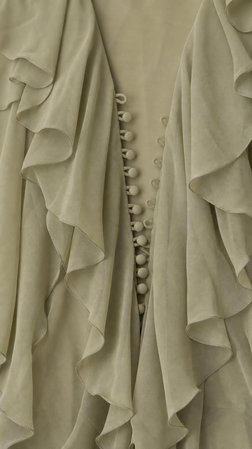 Close up of cascading ruffles and fabric buttons on Sage Green dress