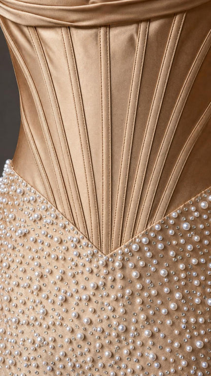 Close-up detail of the structured corset bodice and pearl embellishments