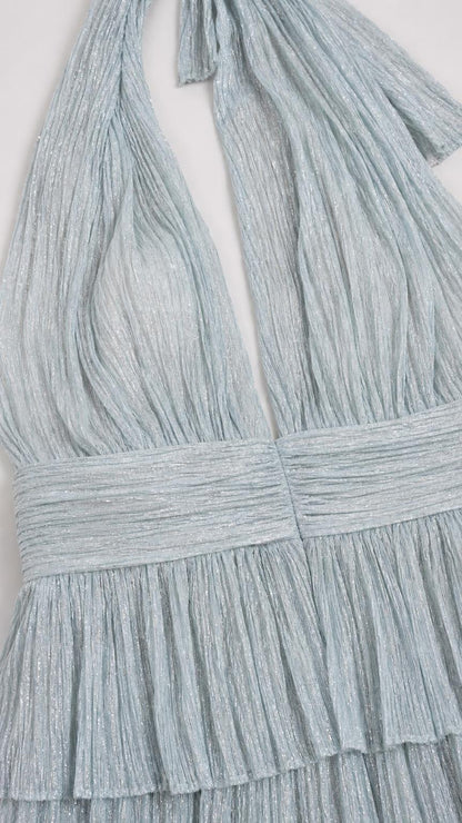 Close-up detail of halter neckline, bodice, and layered ruffles