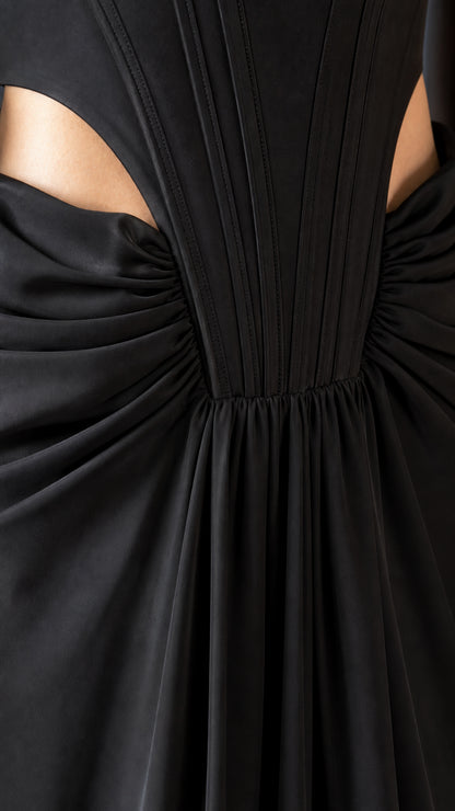 Close-up of waist cutouts and pleated bodice construction