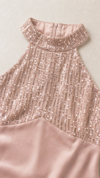Close-up detail of sequin halter neckline and satin fabric