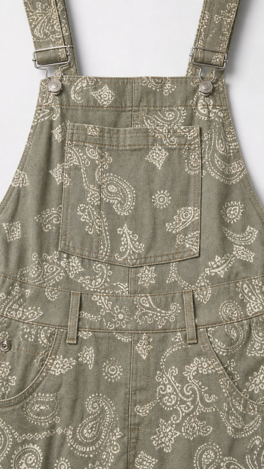 Close-up detail of Sage Green paisley fabric, bib pocket, and buckle hardware