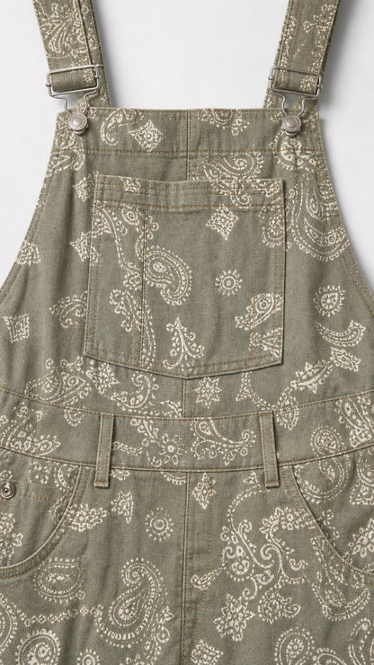 Close-up detail of Sage Green paisley fabric, bib pocket, and buckle hardware
