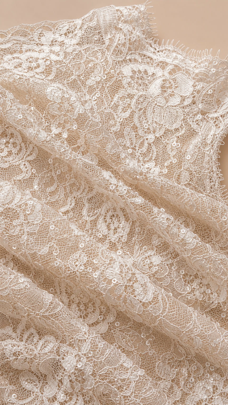 Close-up texture detail of delicate floral lace fabric with subtle shimmering detail