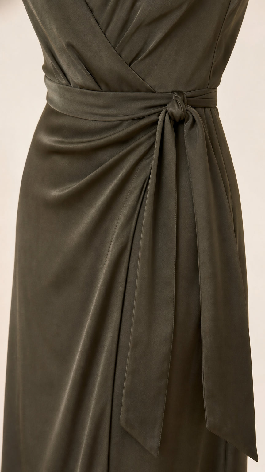 Close-up detail of the wrap bodice and side tie knot in olive green