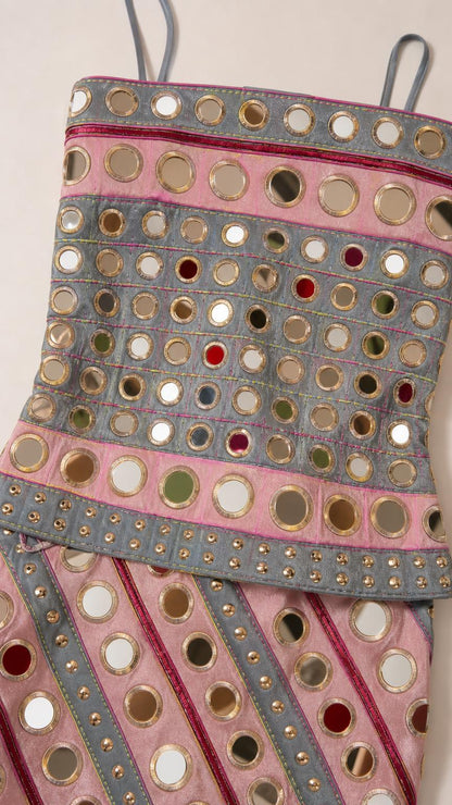 Close up of mirror embellishments and fabric texture