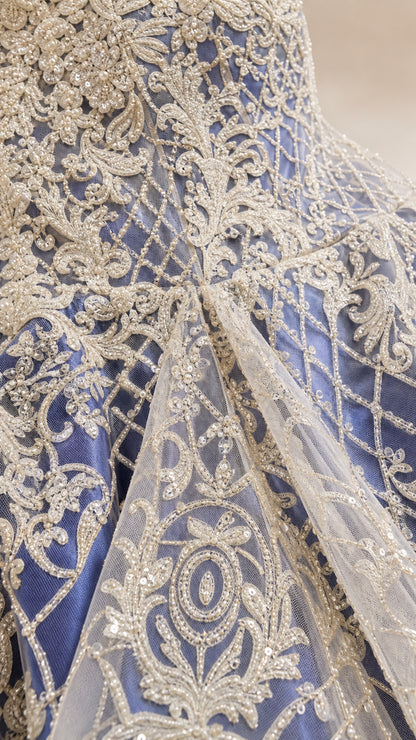 Close-up detail of metallic embroidery and beadwork on bodice