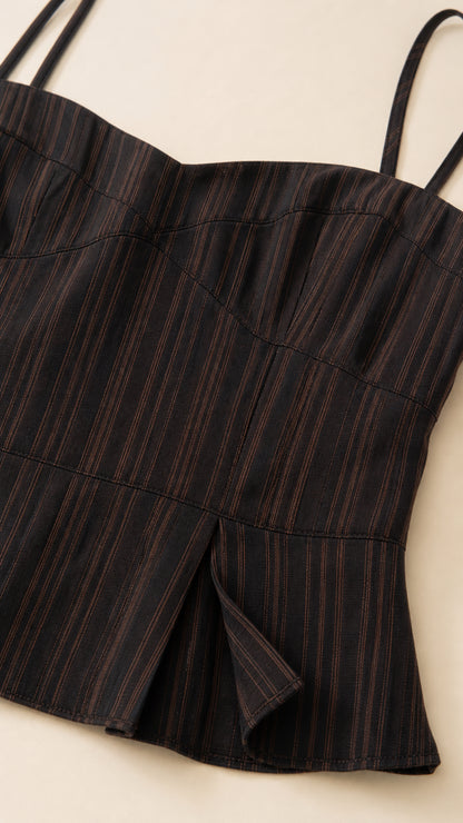 Close-up detail of the black striped camisole fabric and construction