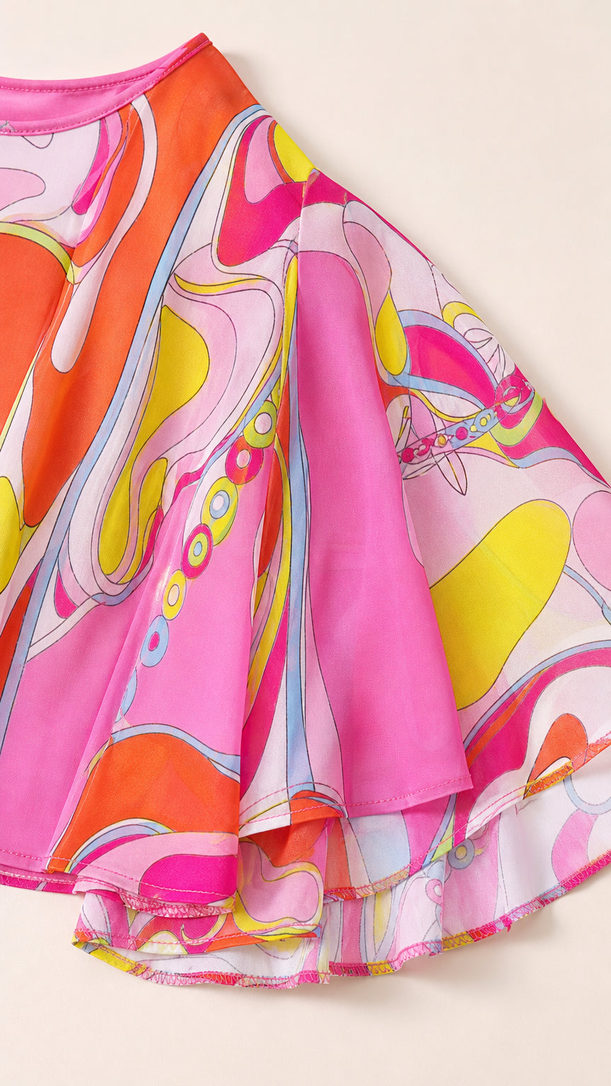 Close-up detail of the colorful silky fabric texture and hemline