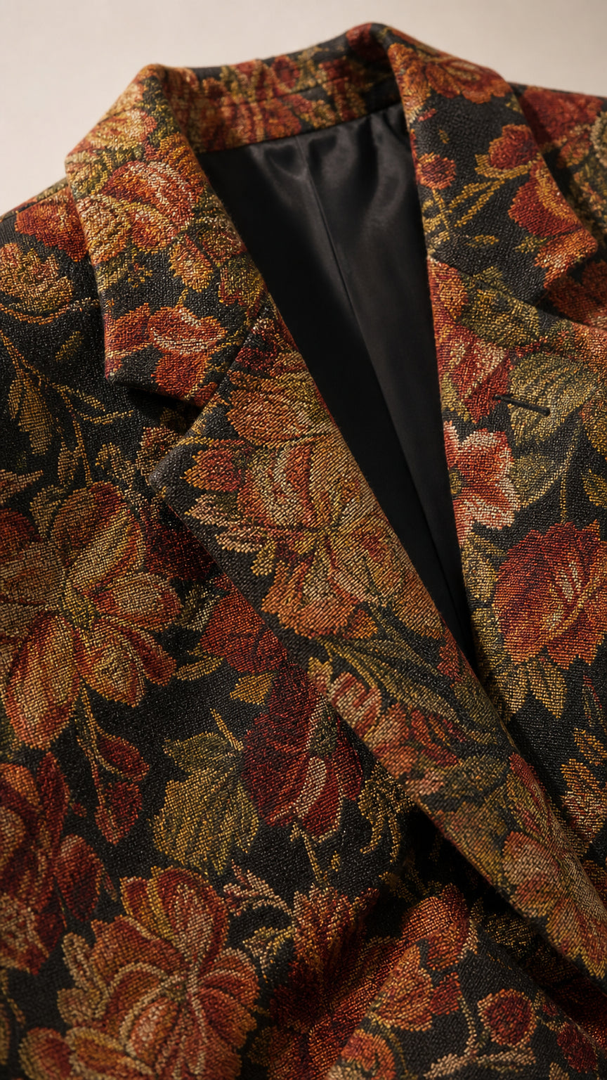 Close-up detail of the textured floral jacquard fabric and lapel construction