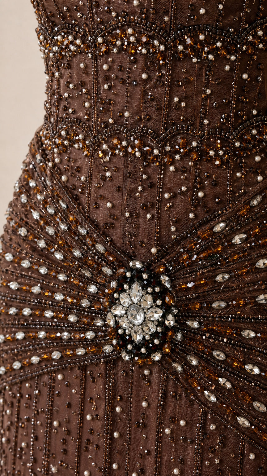 Close-up detail of the crystal waist brooch and beadwork