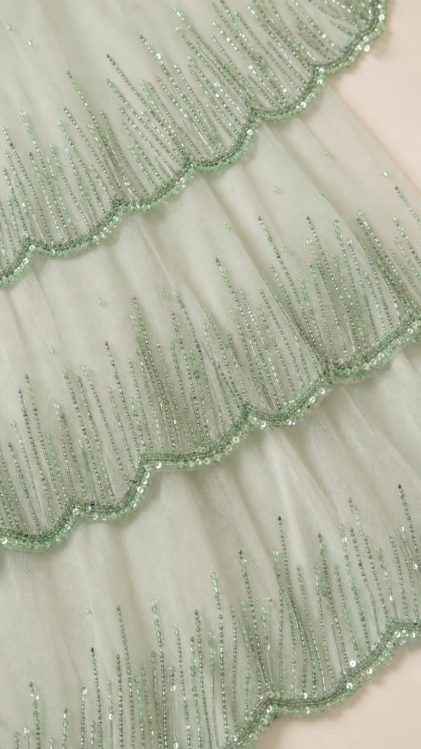 Close-up detail of mint beaded mesh tiers