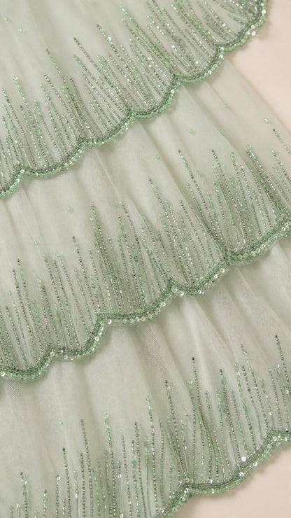 Close-up detail of mint beaded mesh tiers