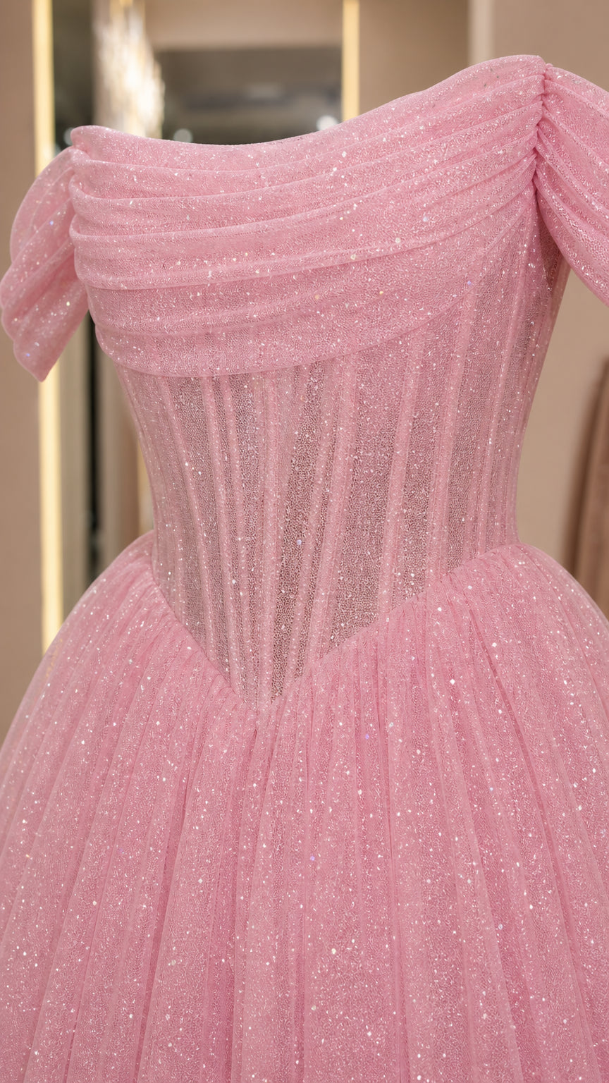 Close up of draped off-shoulder sleeve and bodice structure