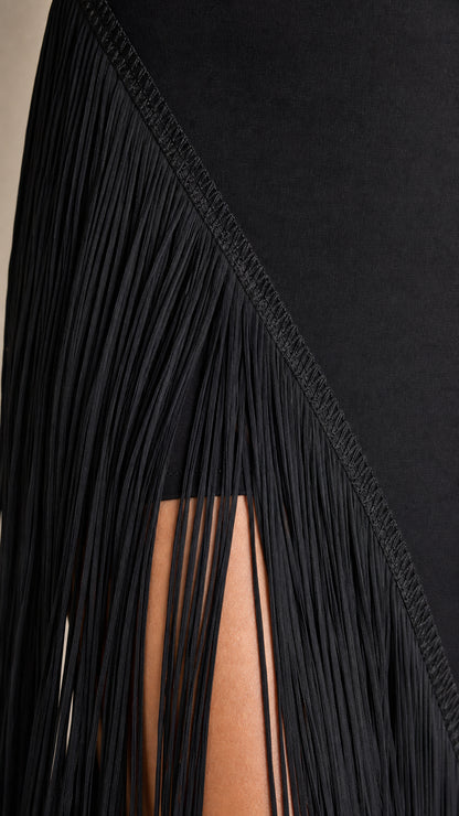 Close-up of black fringe overlay and side slit detail