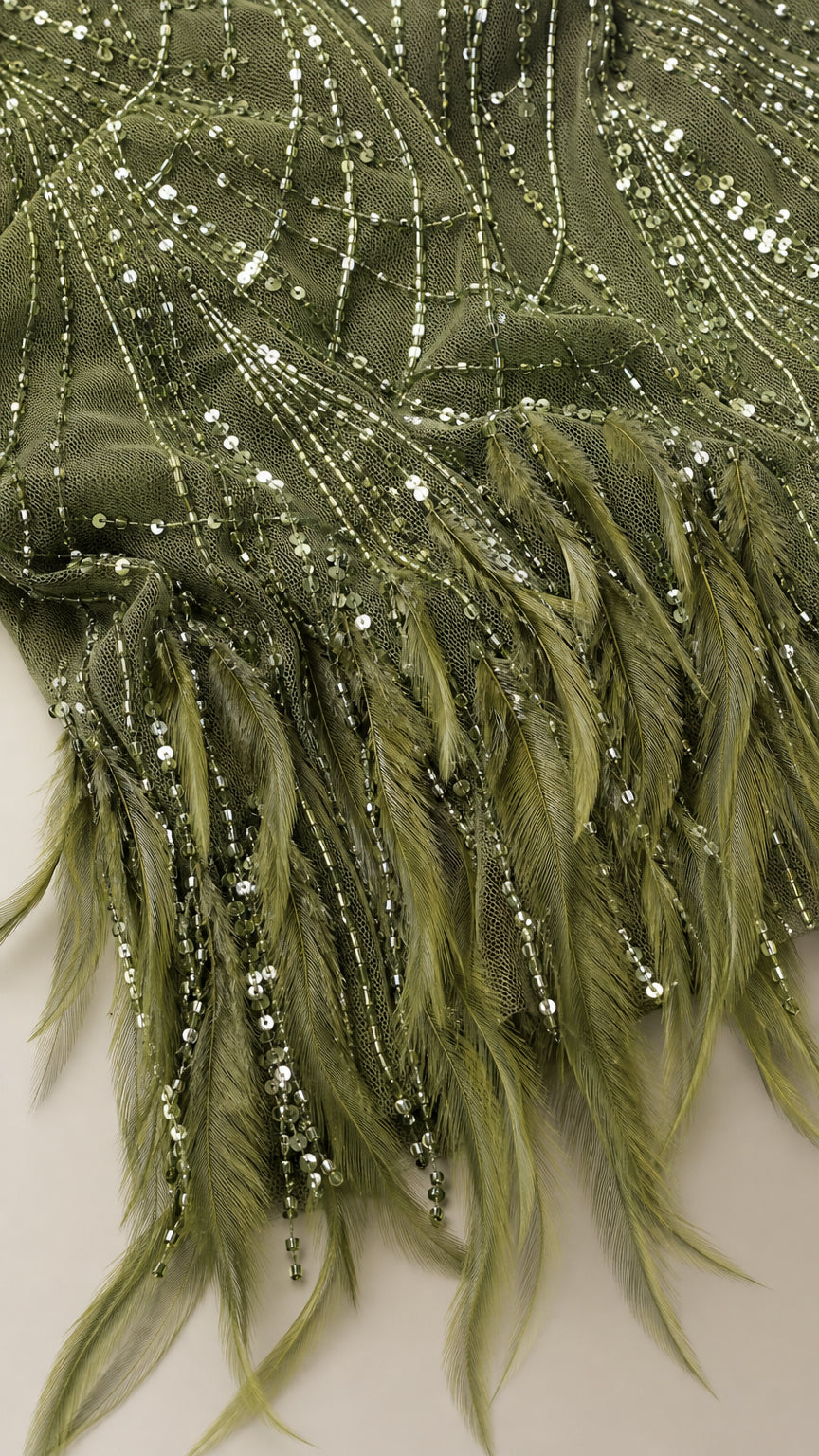Close-up detail of olive green sequins and feather trim