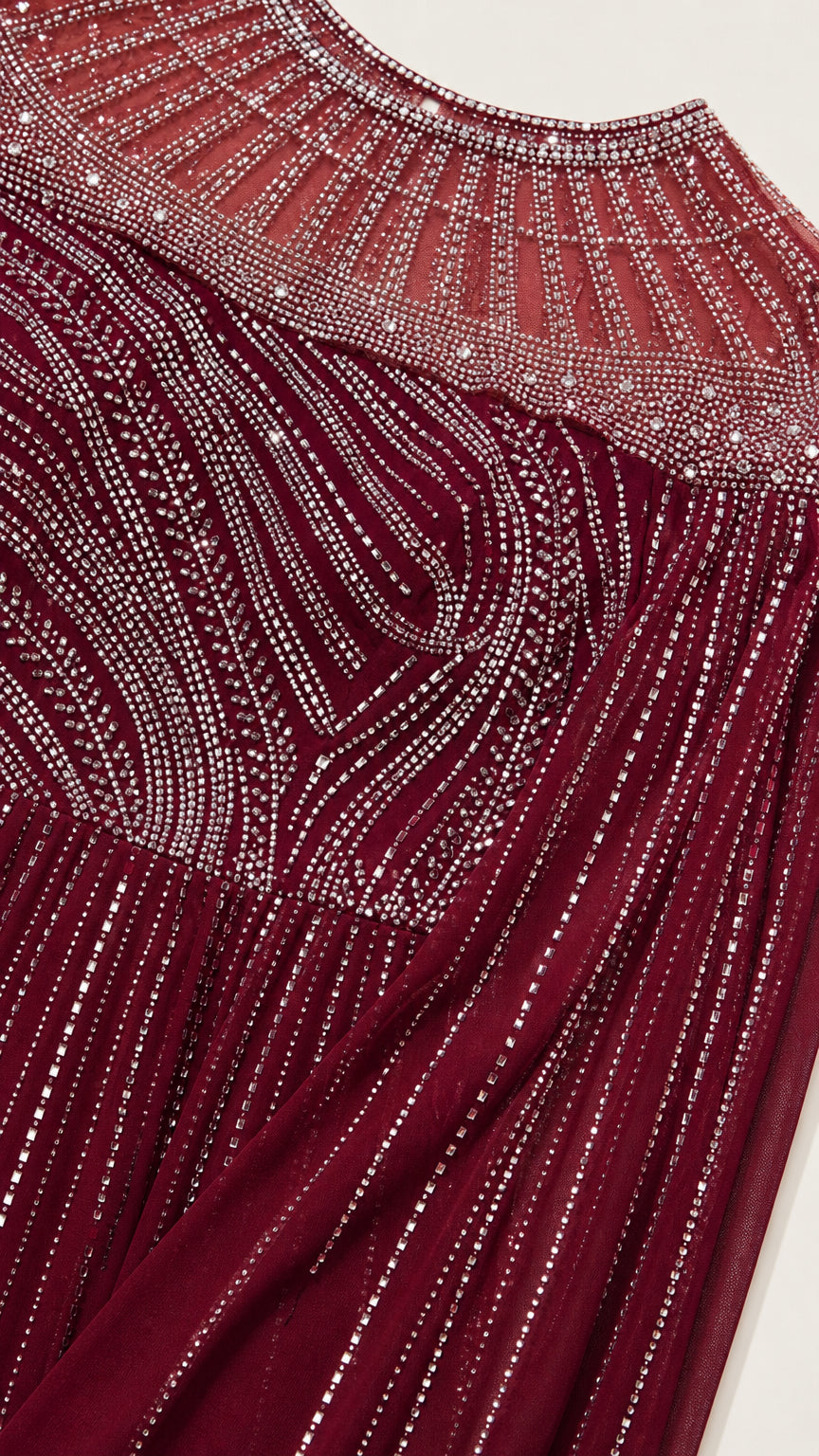 Close-up detail of rhinestone and bead embellishment on neckline