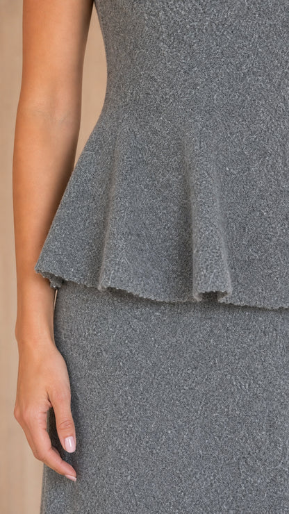 Close-up detail of textured Heather Grey knit fabric and peplum waistline