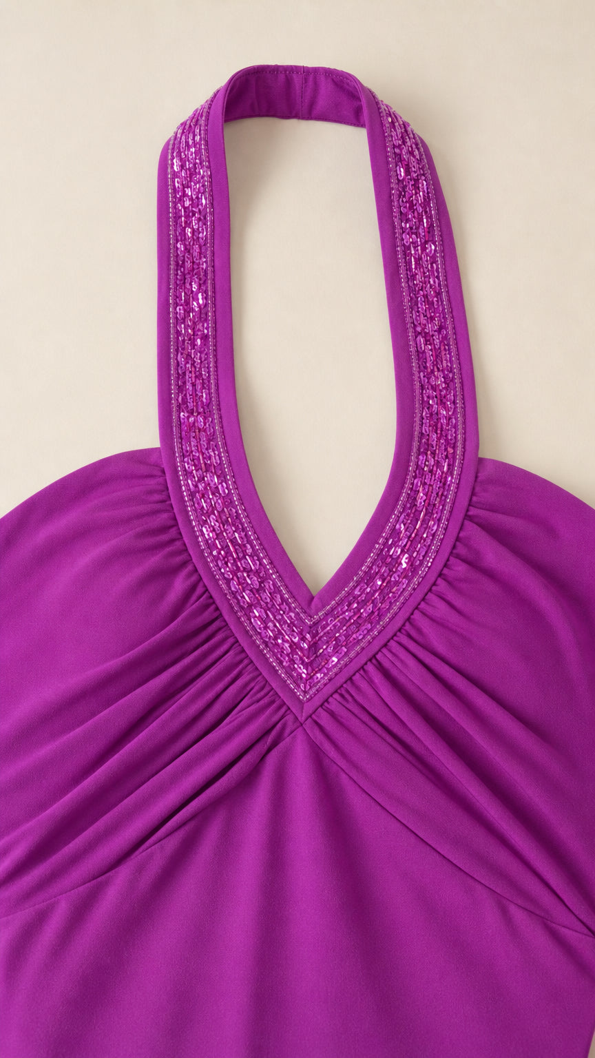 Close-up of rhinestone embellished halter neckline and ruched bodice