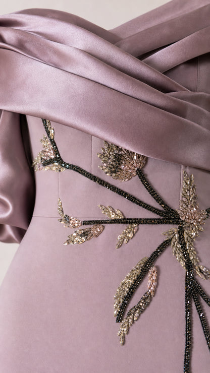 Close-up of beaded floral embroidery and draped satin bodice